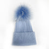 Топла зимна шапка с помпон - синя